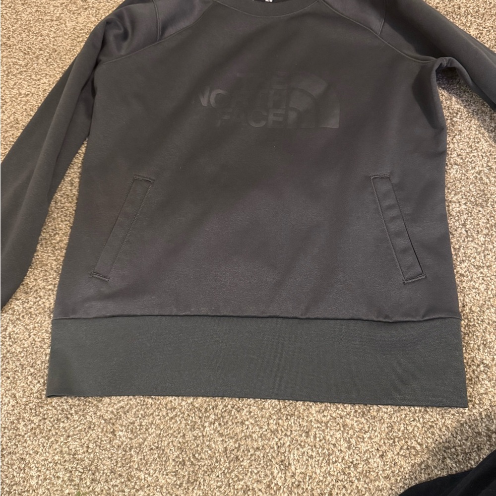 The North Face woman’s Charcoal Crewneck Sweater